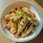Tantalizing Chinese Steamed Chicken with Ginger Scallion Sauce